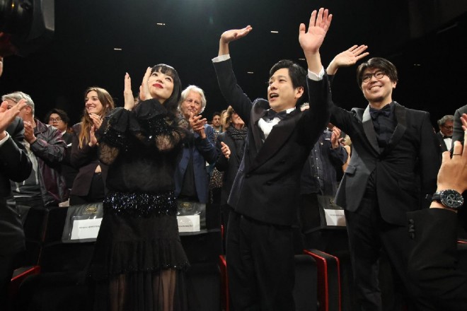 The Exit 8 team responds to a standing ovation at Cannes